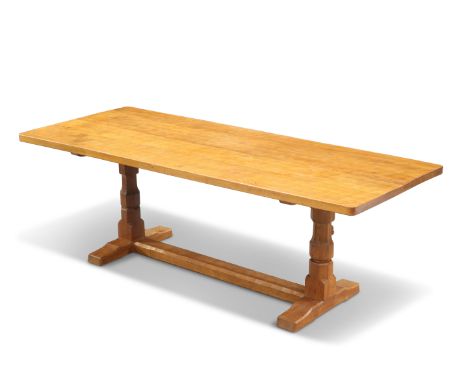 ROBERT THOMPSON OF KILBURN, A MOUSEMAN OAK 7-FOOT DINING TABLE, of refectory-type with faceted baluster uprights, adzed top a