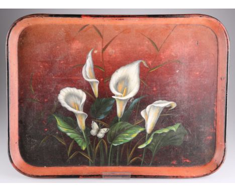 A VICTORIAN TOLEWARE TEA TRAY, rectangular form, the centre painted with peace lilies and a butterfly, to a red ground. 40.5c