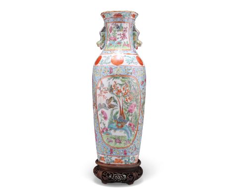 A CHINESE TURQUOISE-GROUND VASE, 19TH CENTURY, of shouldered ovoid form with vertical ribs, enamel painted with birds, butter