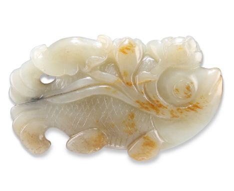 A CHINESE JADE CARVING, of a fish clasping a lotus in its mouth. 8.5cm by 5cm by 1cmCONDITION REPORTGood condition, no noted 