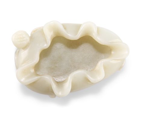 A CHINESE JADE LOTUS LEAF BRUSH WASHER. 2cm by 6.5cm by 4cm&nbsp;CONDITION REPORTGood overall condition.&nbsp;