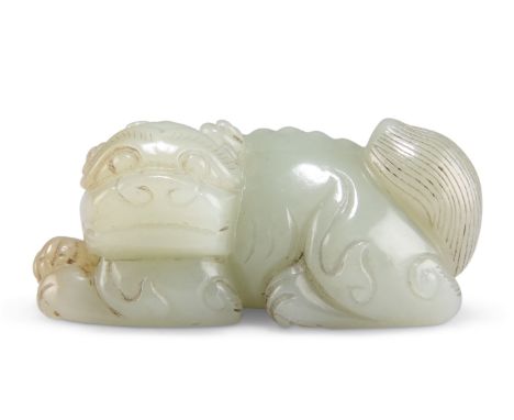 A CHINESE JADE CARVING, of a recumbent foo dog. 3.5cm by 7cm by 4cmCONDITION REPORTGood condition, no noted damage.&nbsp;