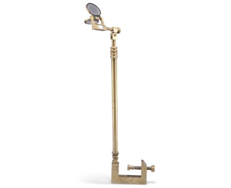 A VICTORIAN BRASS CAMERA LUCIDA, unmarked, with clamp attachment and adjustable upright, with prism and two lenses. 33cm high