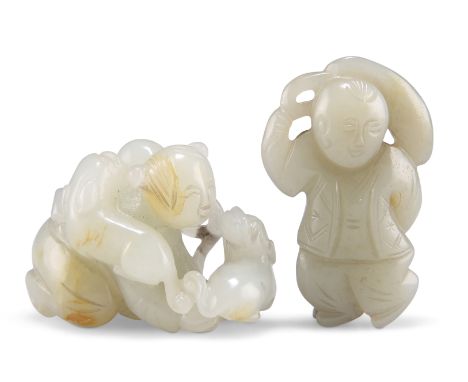 TWO CHINESE JADE CARVINGS, one depicting a child playing with a lion dog and a brocade ball, 3.5cm by 5.5cm by 2cm; the other