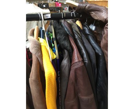 A group of 7 leather jackets, a leatherette jacket, a blouse, wetsuits and a fur coat  