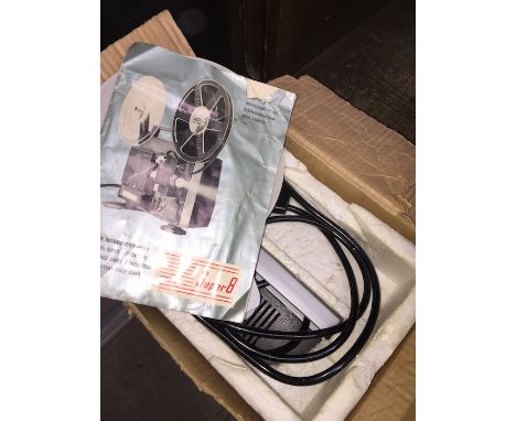 A Tower Super 8 autozoom cine projector in original box with instructions manual and reel.  