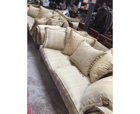 A large modern gold and biege coloured 3 piece suite with cushion backs (two 3 seater sofas & one 2 seater sofa)Condition: no