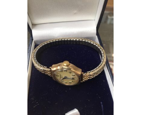 A 9ct gold Rotary wristwatch with plated strap.  