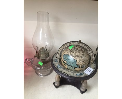 Small globe and a glass oil lamp  