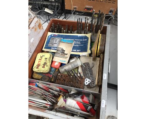 A drawer of drill bits and other tools  