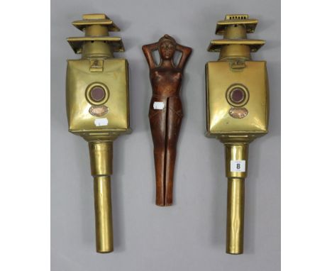 A pair of reproduction brass car lamps “Limehouse Lamp Co.”, 18” high; &amp; a pair of novelty carved treen nut-crackers in t
