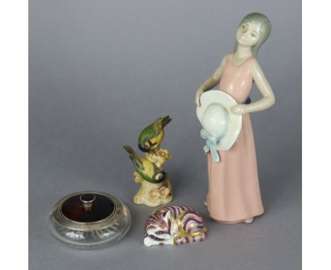 A Royal Crown Derby novelty paperweight in the form of a recumbent cat; a Goebel model “Great Titmouse”; a Lladro porcelain m