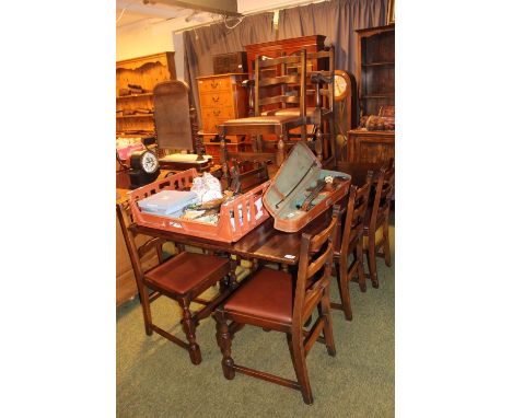 Oak Draw leaf table on carved bulbous legs and a set of 8 Ladder back chairs 