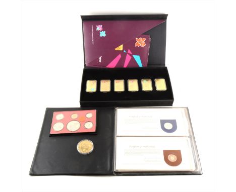 A collection of coins, mostly modern Commemoratives including Olympics gold plated set, first coins presentation packs, etc.,