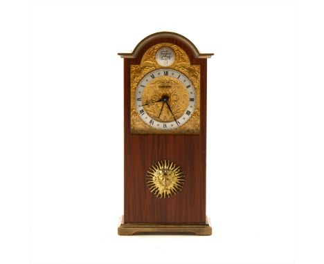 A gilt metal and enamelled miniature Grandfather mantel clock, by Swiza, with Reuge mechanical music alarm, domed and engrave