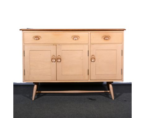 Ercol Sideboard, three draws above three cupboards, W123cm, H82cm, D46cm.