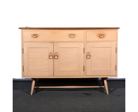 Ercol Sideboard, three draws above three cupboards, W123cm, H82cm, D46cm.