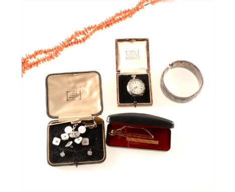 A collection of vintage jewellery, two twig coral necklaces, 72cms and 40cm, a silver 25mm wide half hinged bangle with scrol