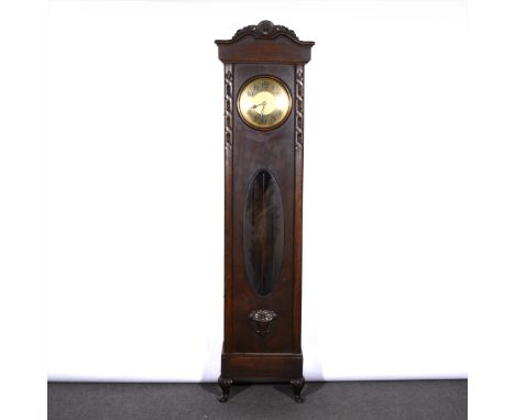 An oak longcase clock, brass finish circular dial, movement striking on gongs by G. B., the case with a shaped pediment piece