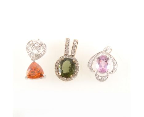 An pink topaz and diamond pendant, the oval mixed cut amethyst 9mm x 7mm, four claw set surrounded by eleven illusion set dia
