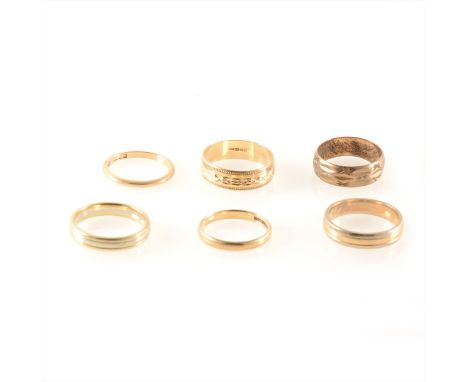 Six 9 carat yellow and white gold wedding bands, plain and patterned designs, 2mm to 6.5mm in width, ring sizes O-R, total we