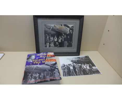 A signed photograph of the Memphis Belle bomber and crew, an unframed print and the book Memphis Belle Dispelling the Myths -