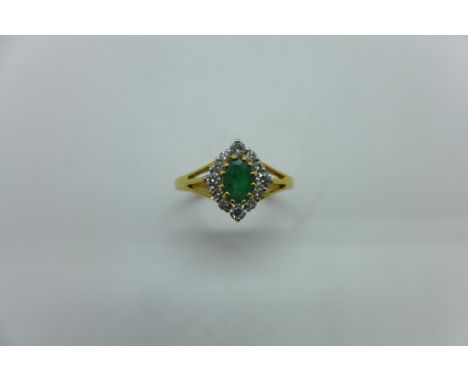 An 18ct hallmarked yellow gold emerald and diamond, weight approx 3.2 grams, as new - Size M 