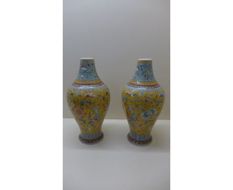 A pair of late 19th century Chinese vases decorated with Shou characters, Phoenix and Peony on a yellow ground, seal mark Dao