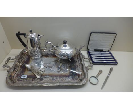 A collection of silver flatware to include a boxed set of silver butter knives with filled handles , a magnifying glass and l