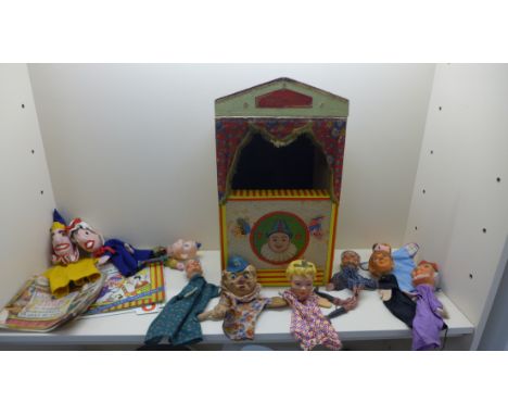 A vintage Punch and Judy Theatre with ten glove puppets and two booklets, one with card stage 