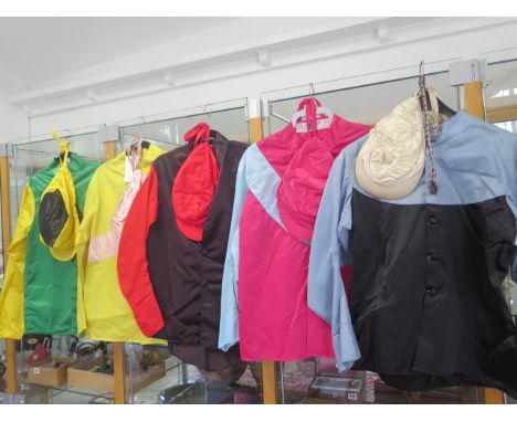 A collection of five racing silks and caps including a print of the silks Forest Tune M Fitgerald ludlow 2 mile hurdle 19-3-0
