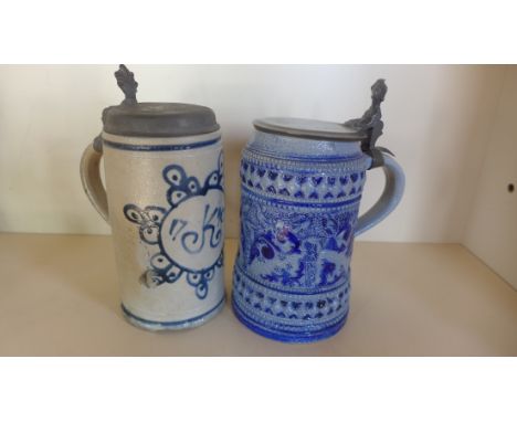 An 18th century German stoneware pewter-lidded tankard decorated in blue glaze with a flower head and dated 'K 1790' (in good