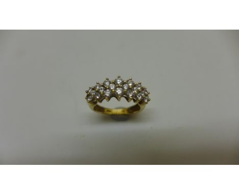 A 14ct yellow gold diamond cluster ring, size K, approx 3.3gs, in generally good condition. Marked 14k. 