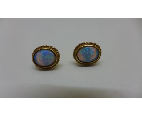 A pair of 9ct yellow gold opal earrings 10x8mm total approx 1.8gs, generally good condition. Butterflies marked 375. 