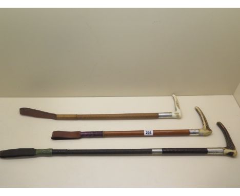 3 vintage riding crops all with horn handles 