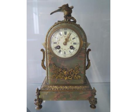 A French green onyx marble mantle-clock with ormulu decoration, striking on a gong. 30cm tall running in saleroom. 
