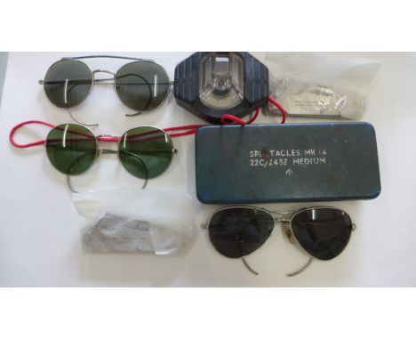 3 pairs of WWII British pilot's sunglasses. Also includes 2 unused British army penknives and a compass. 