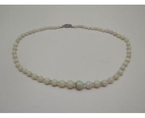 An opal and crystal graduating necklace with a white metal clasp set with a small diamond - Length 41cm, largest approx 10mm 