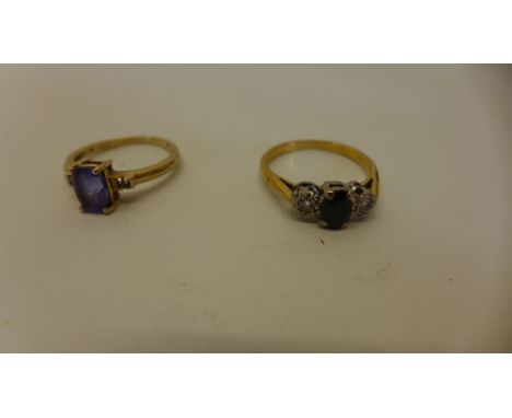 A hallmarked 9ct yellow gold Amethyst and diamond ring size L - , approx 2 grams and a hallmarked 18ct yelloow gold sapphire 