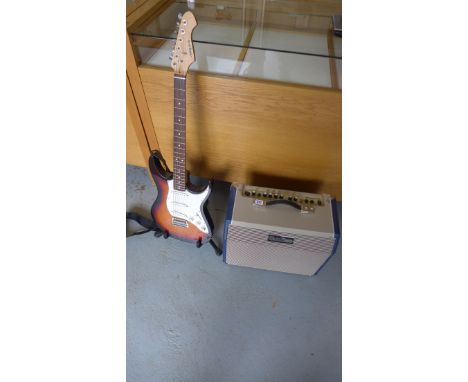 An Aria STG-series 6-string electric guitar and a sub zero SZAcoustic 25C amplifier. 