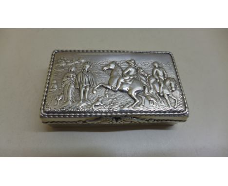 A continental sterling silver embossed snuff box with import marks 6.5cm wide. Approx 1.5 troy oz, some slight bending and we