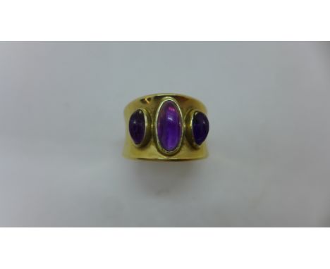 A 14ct yellow gold three stone cabochon amethyst ring marked 585, ring size M - approx weight 5.5 grams - in generally good c