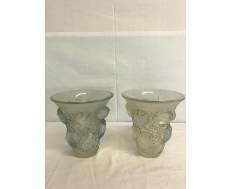 A pair of R Lalique frosted glass vases depicting birds and branches. 18cm in height. 