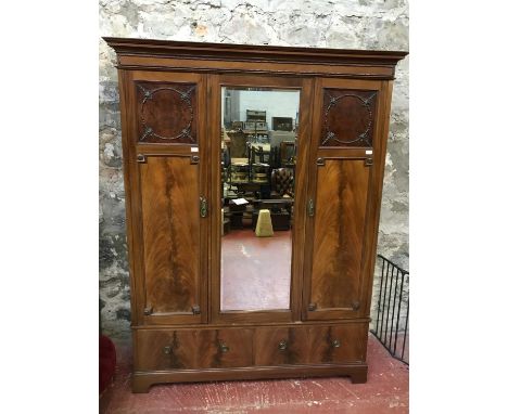 A Victorian triple wardrobe with mirror centre, 2 under drawers & brass fittings to the interior 