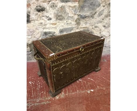 Leather and stud design bound trunk with religious scene and brass straps