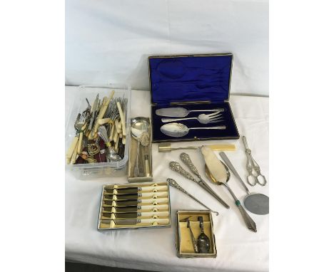 A collection of EP flatware's to include boxed cutlery sets, Silver handled glove stretchers & button hook etc