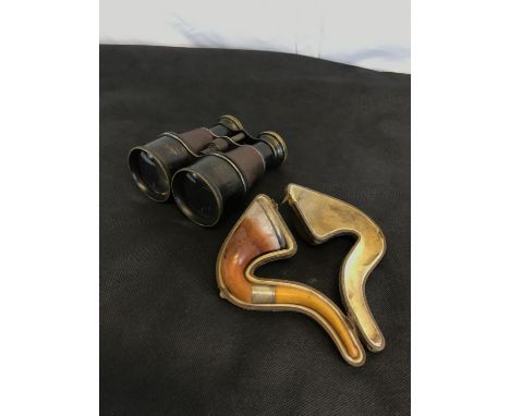 Field binoculars together with a vintage smoking pipe with silver collars and amber pipe in a fitted case 