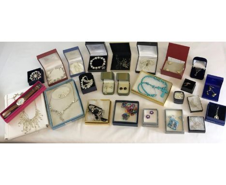 A Large collection of boxed silver & costume jewellery to include Swarovski crystal sets, Brooches & watch etc 