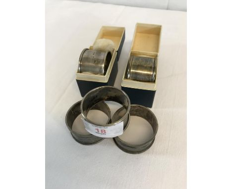 2 boxed London Silver napkin rings, together with 3 Birmingham silver napkin rings 