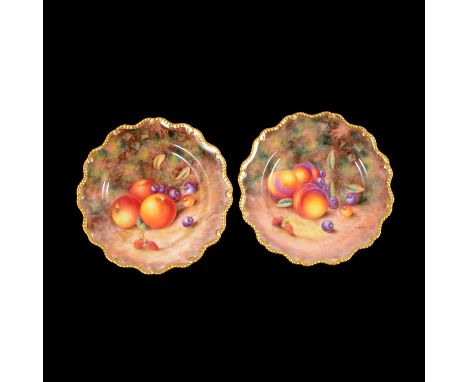 Pair of Royal Worcester fruit painted cabinet plates, by Harry Ayrton, serpentine outlines with gilt edge, diameter 22.5cm.  